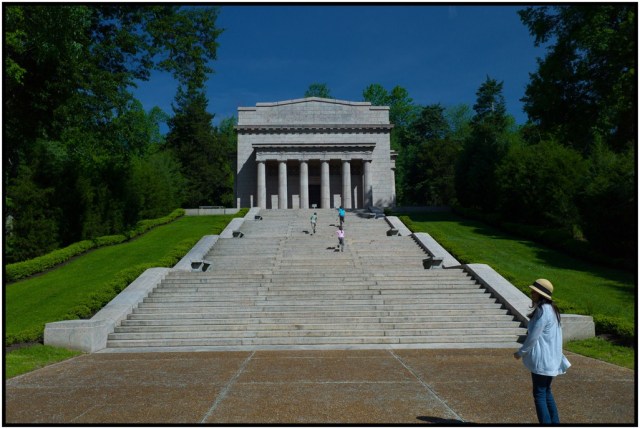 Kids racing up the memorial steps - 56 of them for each year of Lincoln's life. The building sits at the top of the hill and encases the original log cabin foundation.