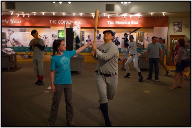 Isabella checking out the lifesize statues of past patrons - Babe Ruth, in this case.