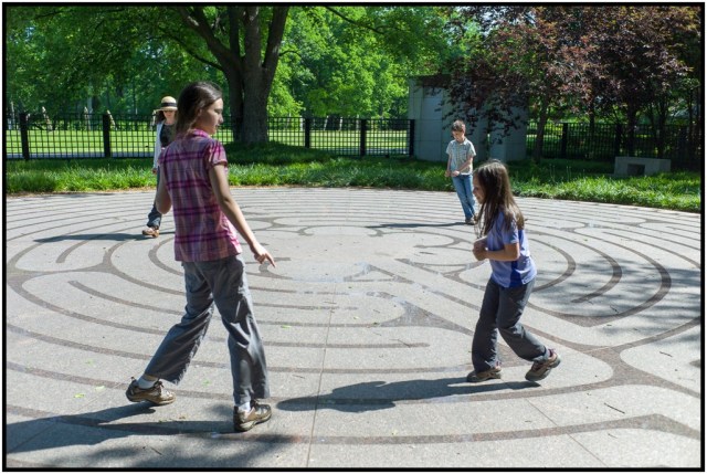 The family working through a labyrinth. This lead to a long and heated discussing about the differences between mazes and labyrinths.