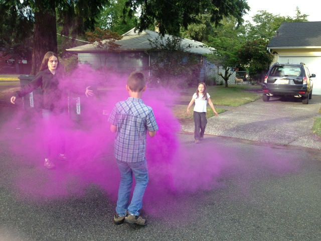 Smoke bombs out in front of Charlie's house.