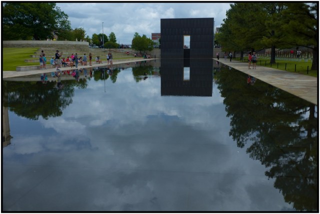 The monument on the end has an identical mate on the opposite side of the water.  One is engraved "9:01" and the last "9:03."  The bomb went off at 9:02 and is represented by the chairs, symbolizing how everything changed in just one minute ... and then life resumed once again for everyone who had to move on.  It's beautiful.