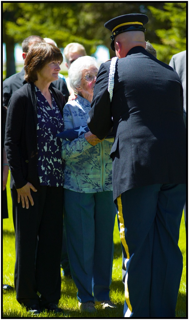 Soldier presenting the flag to Grandma