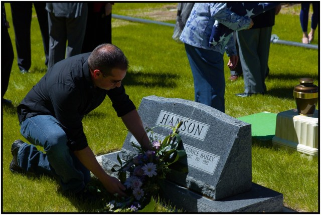 Brian placing a wreath on the gravesite.