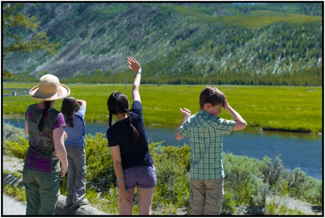 Phuong trying to get some bison's attention far off in the distance