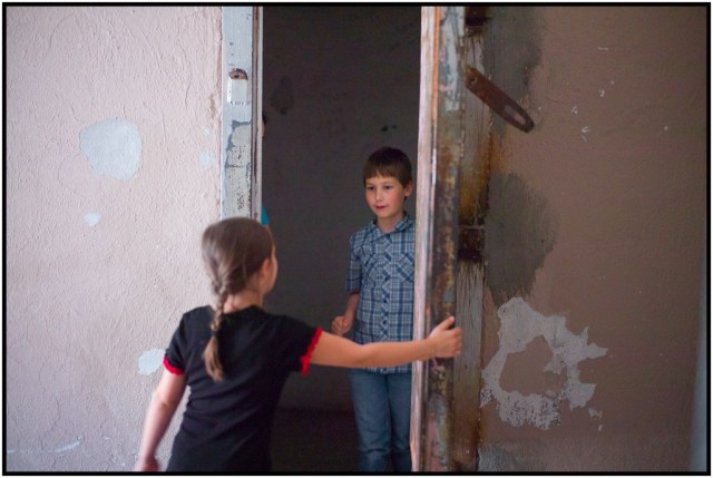 Josie closing up one of the doors on Holden and Isabella in the "Solitary Confinement" wing.