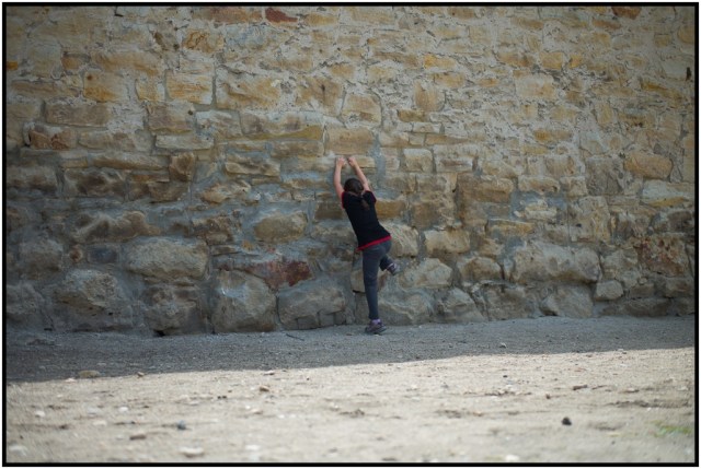 Scaling the wall.